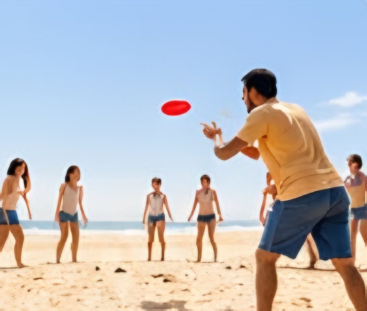 Playing frisbee on the beach