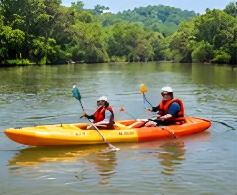Two people kayaking on the river