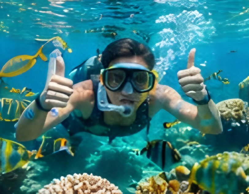 Snorkeller giving thumbs up underwater
